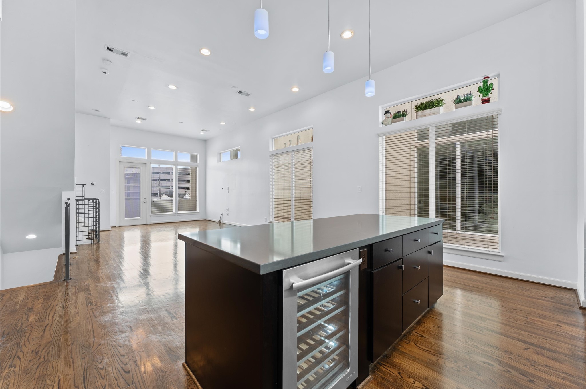 120 Pierce Street Houston, TX 77002 - Photo 17 of 45 a kitchen with counter top space and wooden floor