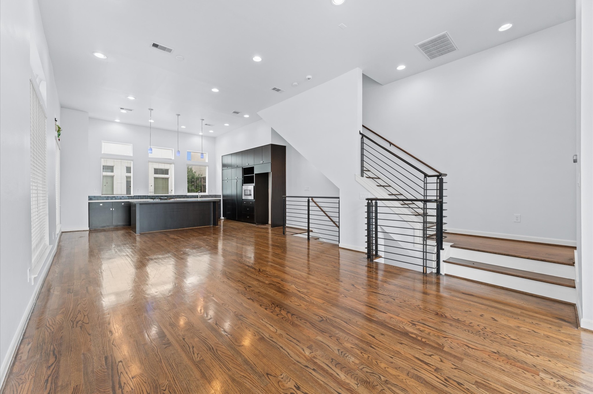120 Pierce Street Houston, TX 77002 - Photo 21 of 45 a view of a room with wooden floors and kitchen view