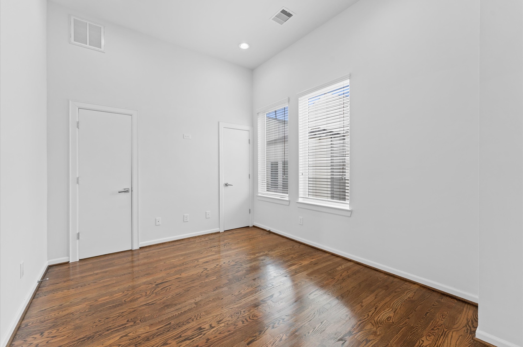 120 Pierce Street Houston, TX 77002 - Photo 26 of 45 a view of an empty room with wooden floor and a window