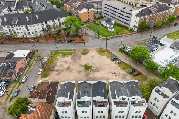 a view of swimming pool with outdoor seating and plants