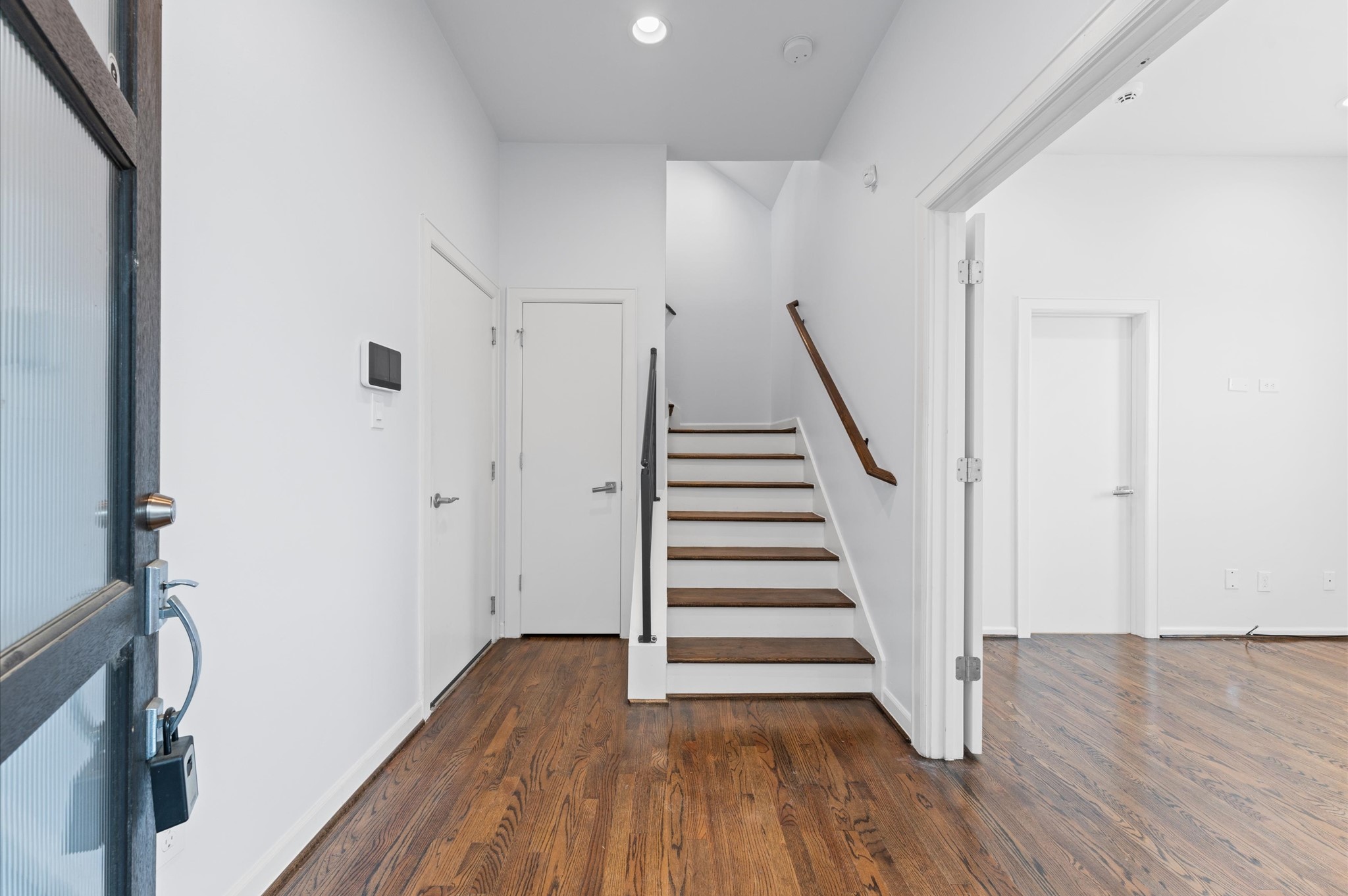 120 Pierce Street Houston, TX 77002 - Photo 6 of 45 a view of a hallway with wooden floor and entryway