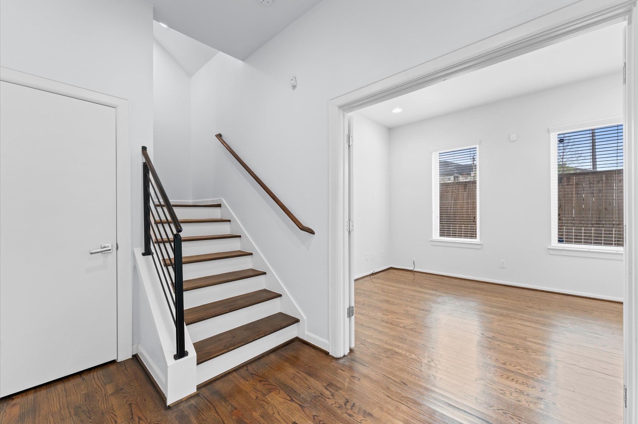 120 Pierce Street Houston, TX 77002 - Photo 7 of 45 a view of entryway with wooden floor and stairs