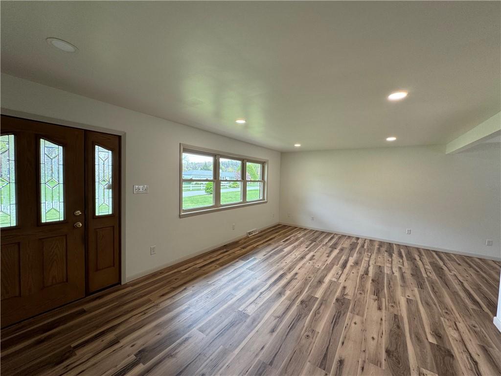 86 McHenry Road Indiana, PA 15701 - Photo 4 of 25 an empty room with wooden floor and windows