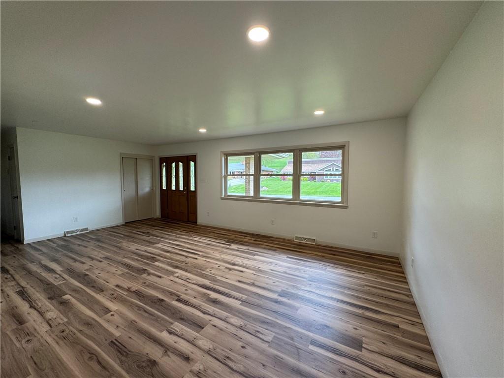86 McHenry Road Indiana, PA 15701 - Photo 7 of 25 a view of an empty room with a window and wooden floor