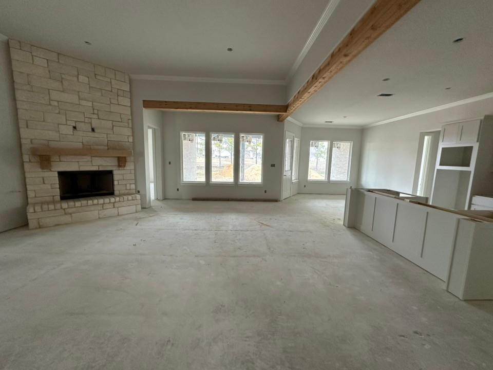 370 Cobb Road Leonard, TX 75452 - Photo 7 of 25 Unfurnished living room with crown molding and a stone fireplace
