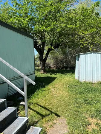 a view of backyard with green space