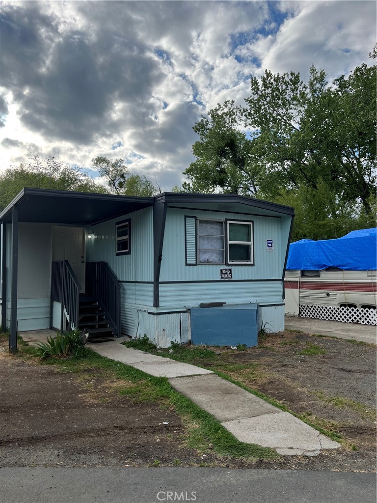 5877 Lake Street, Unit 8 Lucerne, CA 95458 - Photo 3 of 27 a front view of a house with a yard