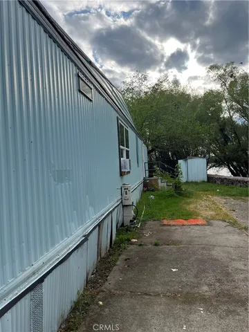 a path view of a house with a yard