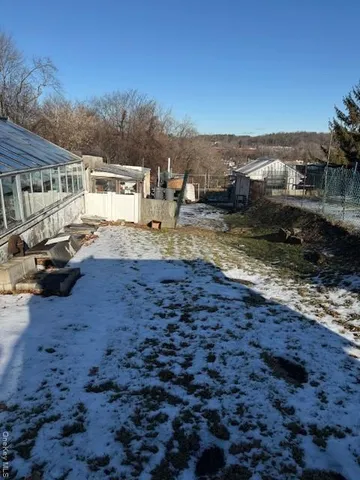 a view of a town with big trees