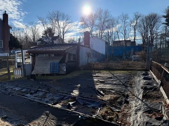 a view of a backyard of the house