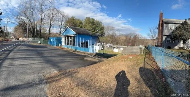 a view of a house with basketball court