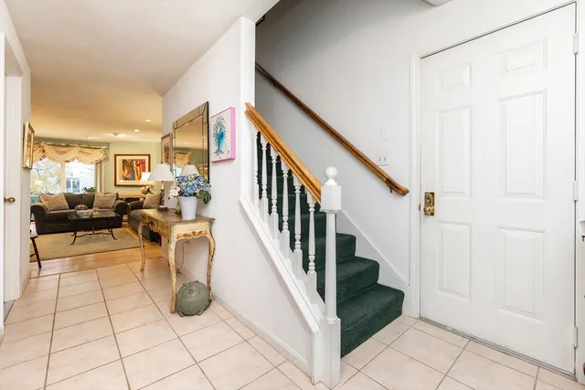 a view of entryway and hall with dining room