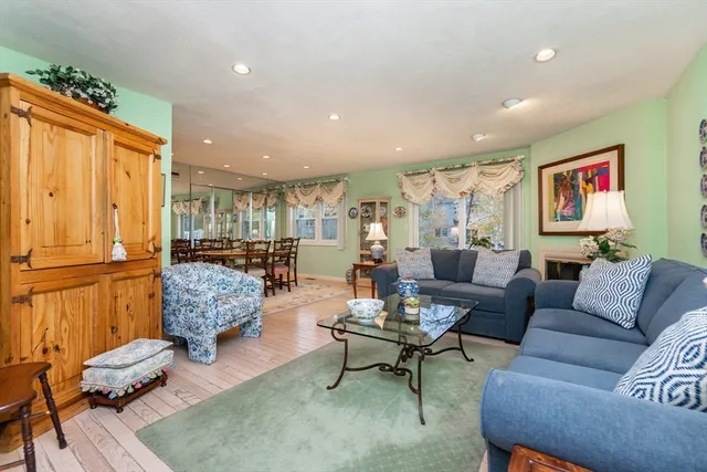 a living room with furniture or couch and a large window