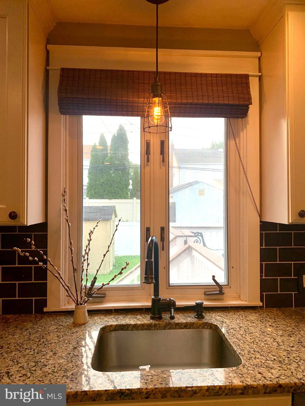 Charming kitchen window view.