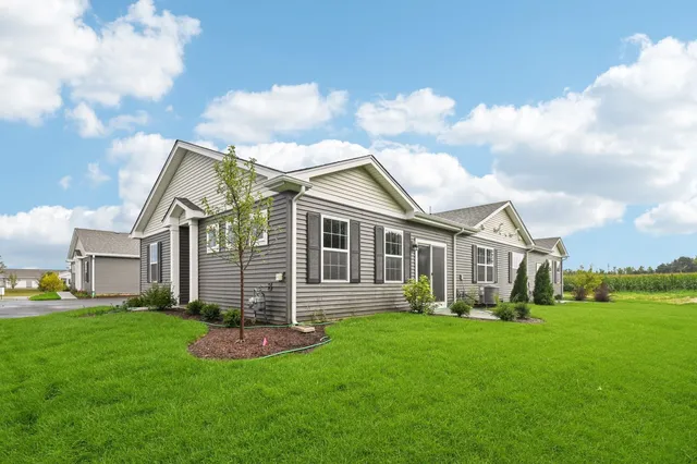 a kitchen with stainless steel appliances granite countertop a refrigerator stove microwave and sink