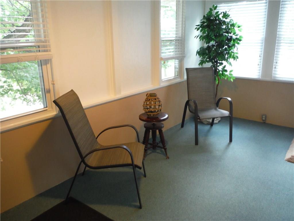 312 Weber Road Sewickley, PA 15143 - Photo 16 of 24 Lots of natural light in the enclosed front porch, three season room!