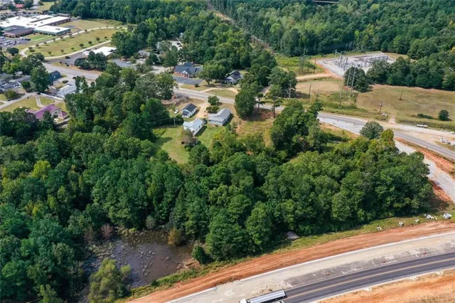 a view of a yard with potted plants