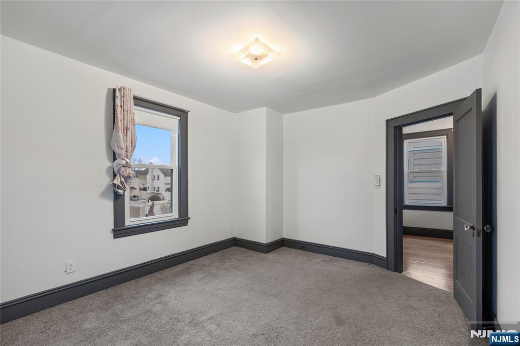 1114 Seib Avenue Elizabeth, NJ 07202 - Photo 18 of 31 an empty room with windows and closet