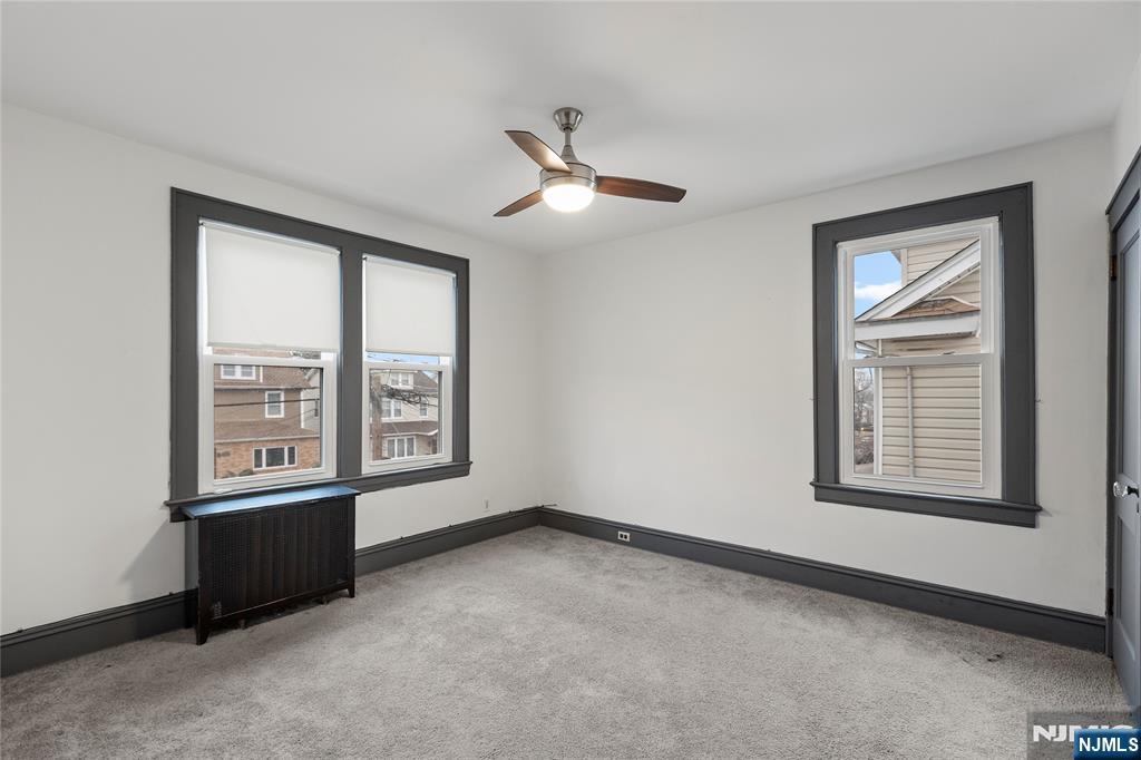 1114 Seib Avenue Elizabeth, NJ 07202 - Photo 20 of 31 a view of an empty room with a window