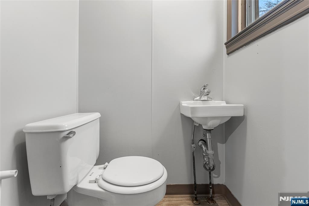 1114 Seib Avenue Elizabeth, NJ 07202 - Photo 22 of 31 a bathroom with a sink toilet and a mirror
