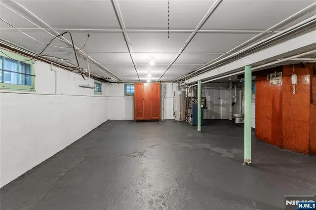 a view of empty room with wooden walls