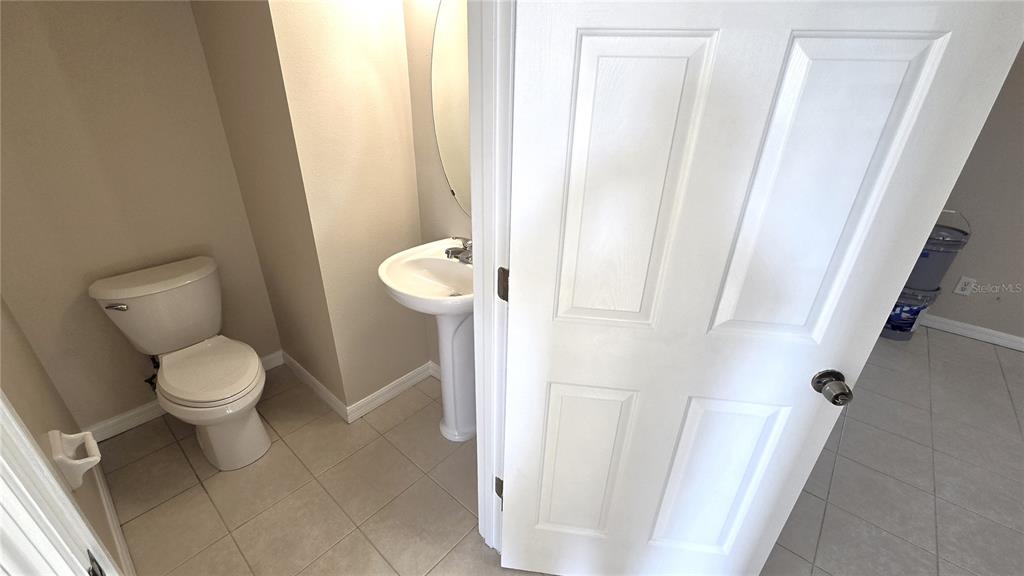 1302 Denman Court Wesley Chapel, FL 33543 - Photo 13 of 28 a white toilet sitting next to a shower