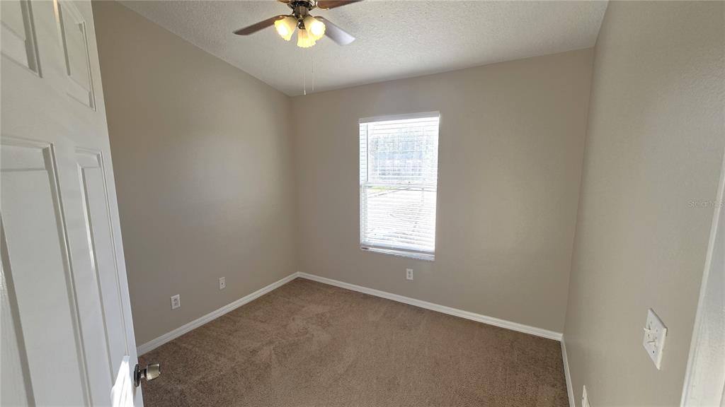 1302 Denman Court Wesley Chapel, FL 33543 - Photo 19 of 28 an empty room with a window