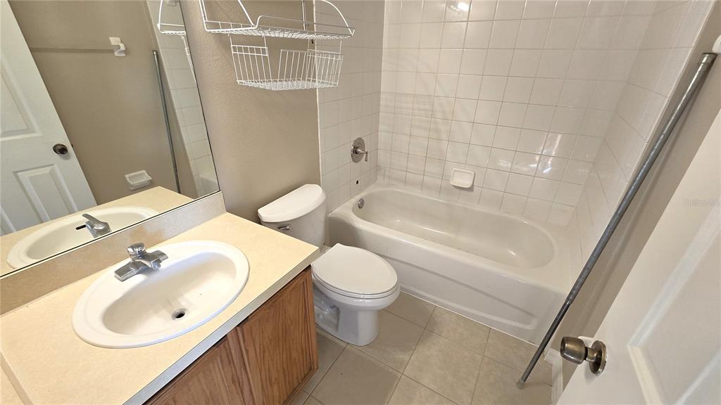 1302 Denman Court Wesley Chapel, FL 33543 - Photo 21 of 28 a bathroom with a sink a toilet and shower