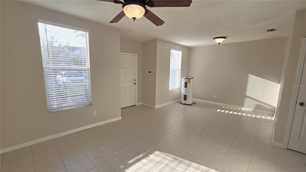 1302 Denman Court Wesley Chapel, FL 33543 - Photo 7 of 28 a view of a livingroom with a staircase