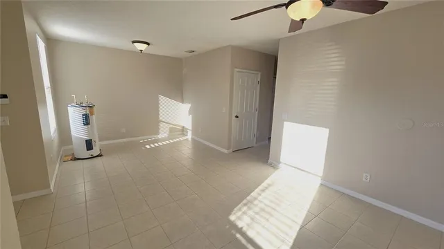 a kitchen with a refrigerator sink stove and cabinets
