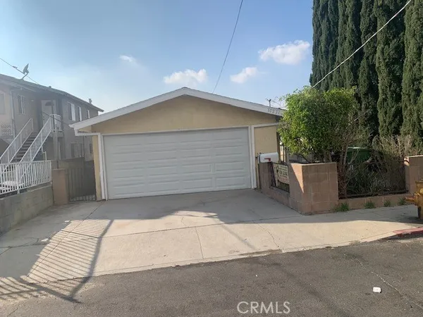 a front view of a house with a garage