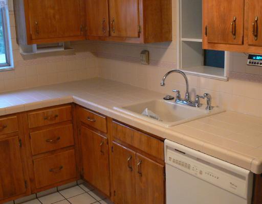 496 Highview Road Pittsburgh, PA 15228 - Photo 4 of 8 Kitchen. The kitchen is fully equipped with disposal, dishwasher, refrigerator, gas stove and under cabinet sound system. Any chef could move right in and prepare a gourmet meal in comfort here.