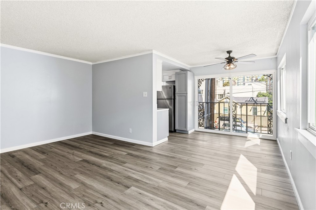 615 East Broadway, Unit 204 Long Beach, CA 90802 - Photo 3 of 27 wooden floor in an empty room with a window