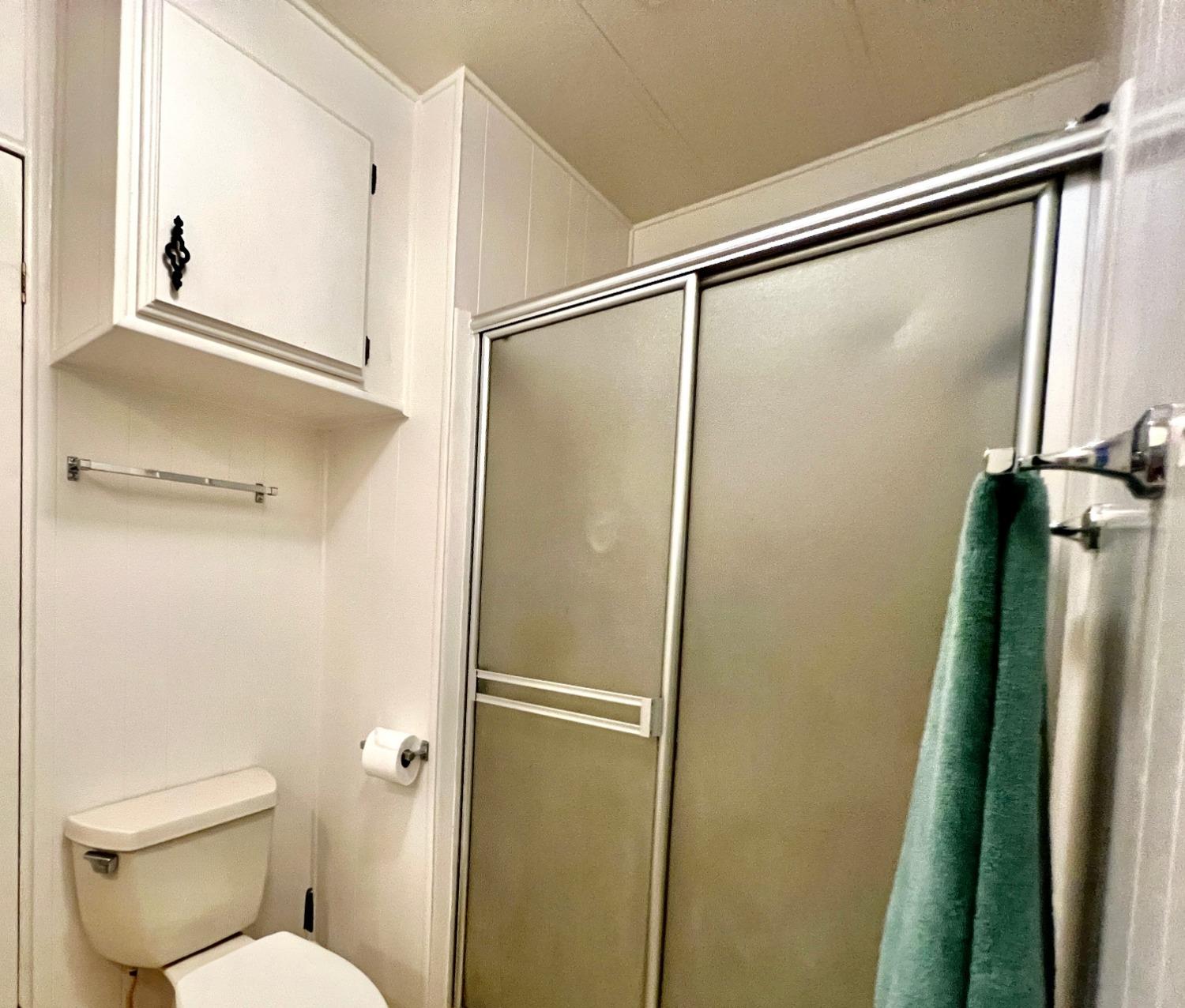 6008 Cackler Lane, Unit 88 Citrus Heights, CA 95621 - Photo 13 of 21 a bathroom with a shower and a toilet