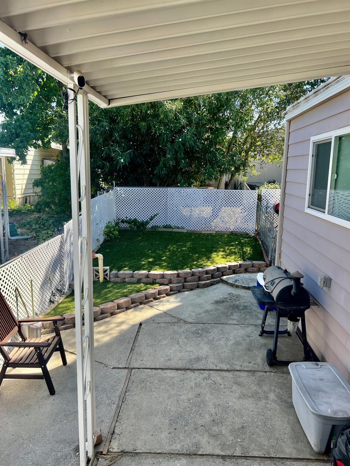 6008 Cackler Lane, Unit 88 Citrus Heights, CA 95621 - Photo 20 of 21 a view of a patio with table and chairs and potted plants