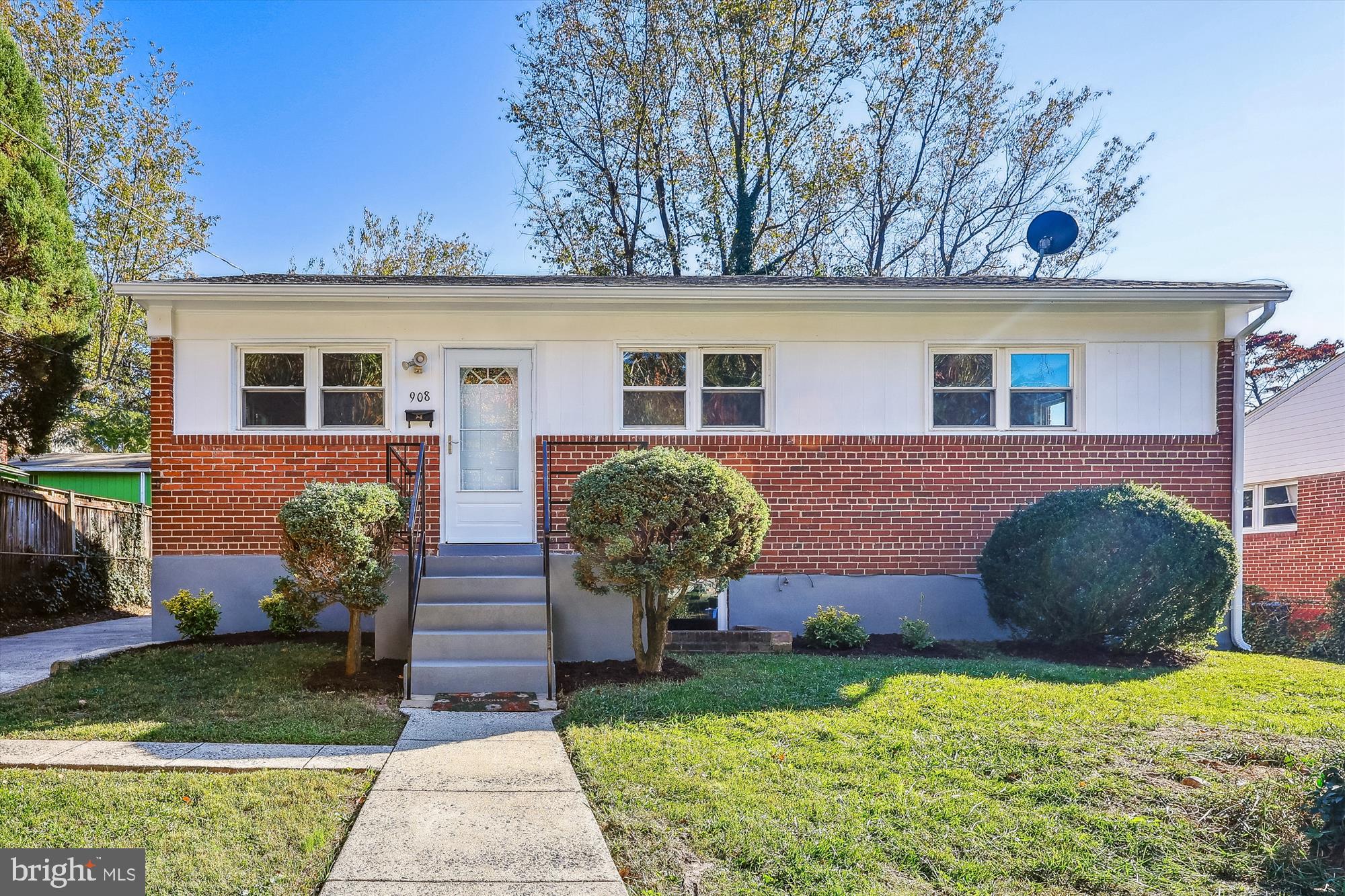 908 Whitehall Street Silver Spring, MD 20901 - Photo 1 of 76 a front view of a house with garden