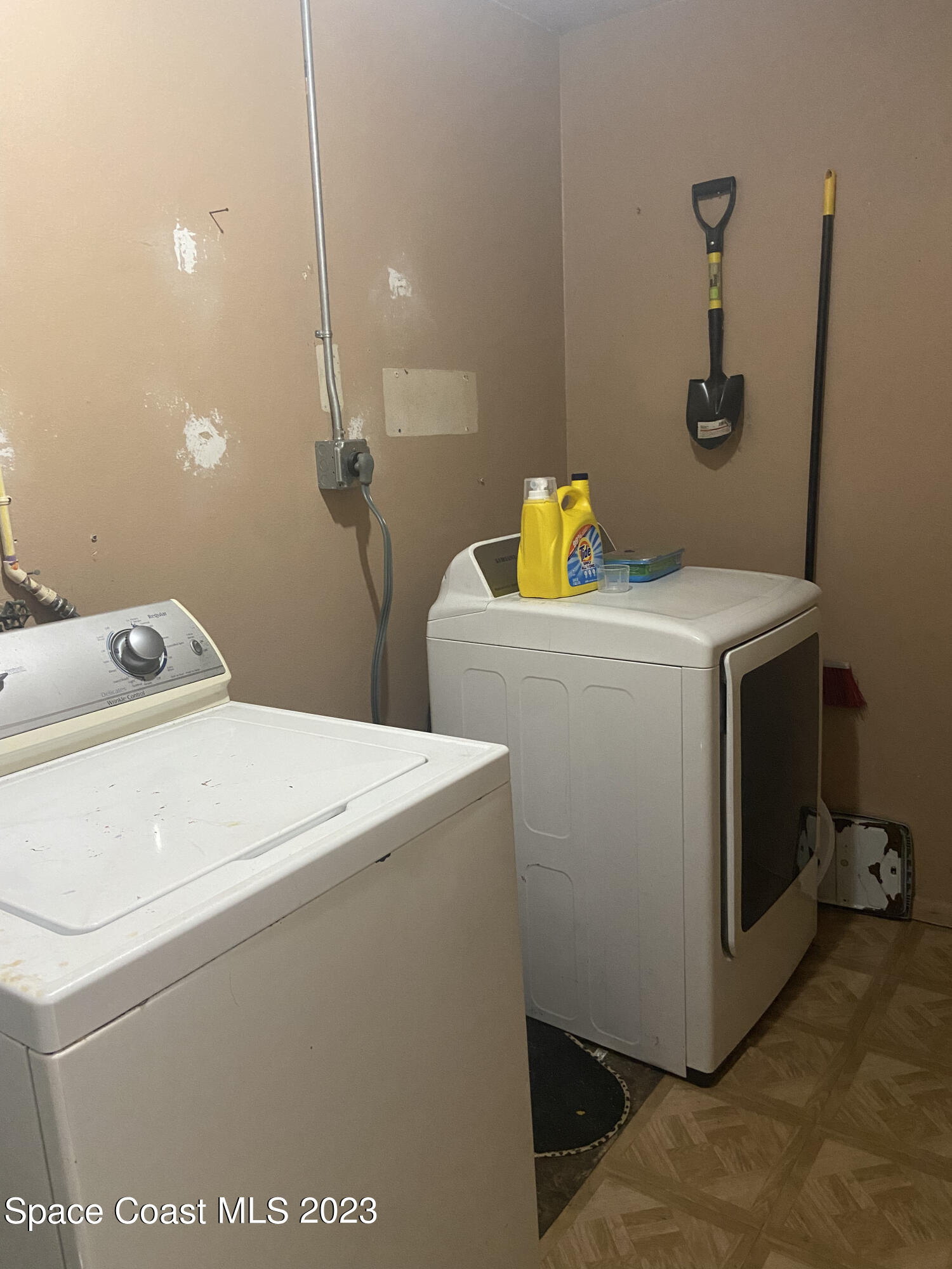 2321 Sarno Road Melbourne, FL 32935 - Photo 8 of 9 a utility room with dryer and washer