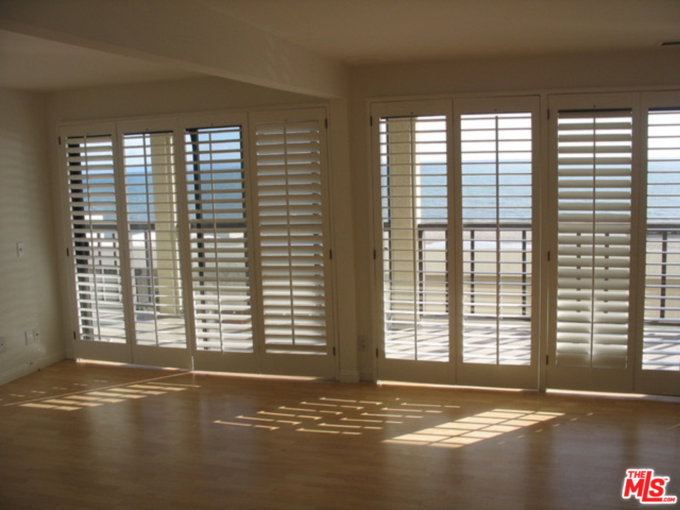 18057 Coastline Drive, Unit 5 Malibu, CA 90265 - Photo 12 of 21 a view of empty room with window and floor to ceiling window