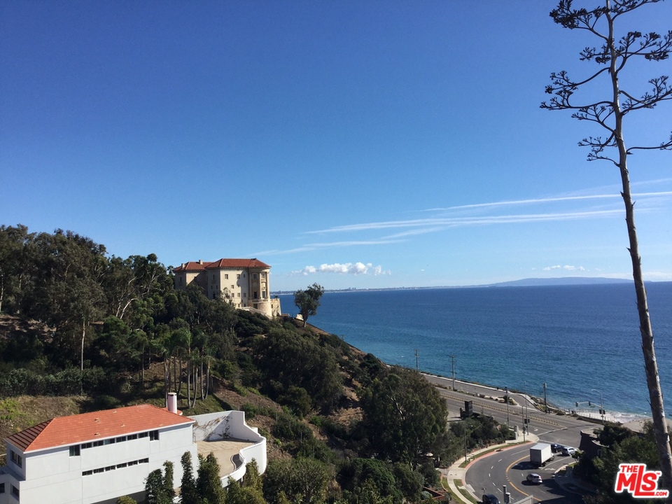18057 Coastline Drive, Unit 5 Malibu, CA 90265 - Photo 20 of 21 a view of a terrace with a bench