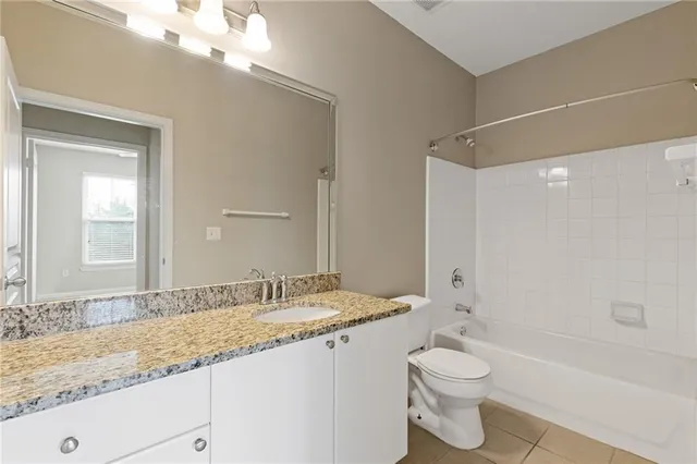 an empty room with a window and a ceiling fan