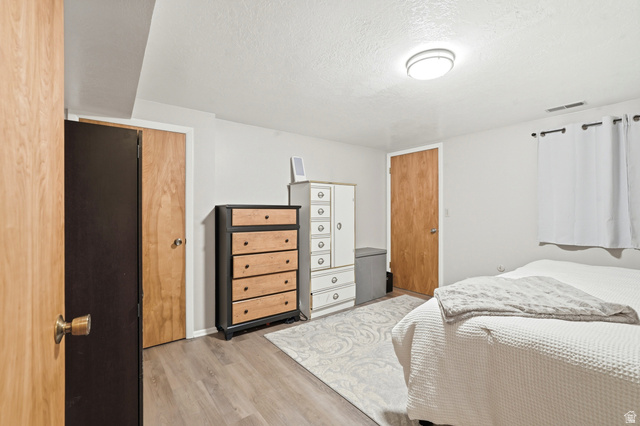 270 East 700 North Logan, UT 84321 - Photo 28 of 42 Neutral-toned room with wood-finish flooring