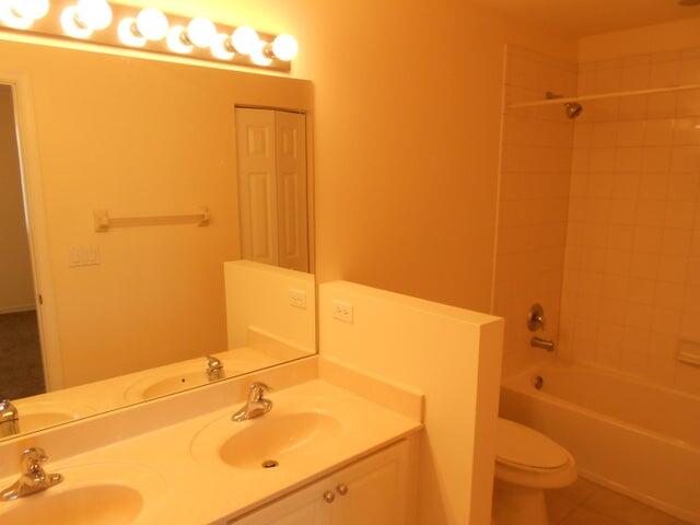 2218 Rockport Road Port St. Lucie, FL 34953 - Photo 15 of 20 a bathroom with a bathtub and a sink