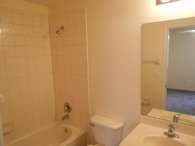 2218 Rockport Road Port St. Lucie, FL 34953 - Photo 17 of 20 a bathroom with a sink a toilet and shower