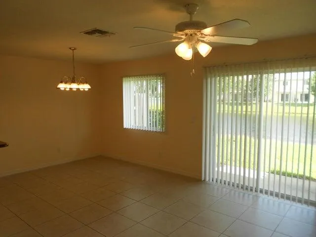 a view of a livingroom with a chandelier fan