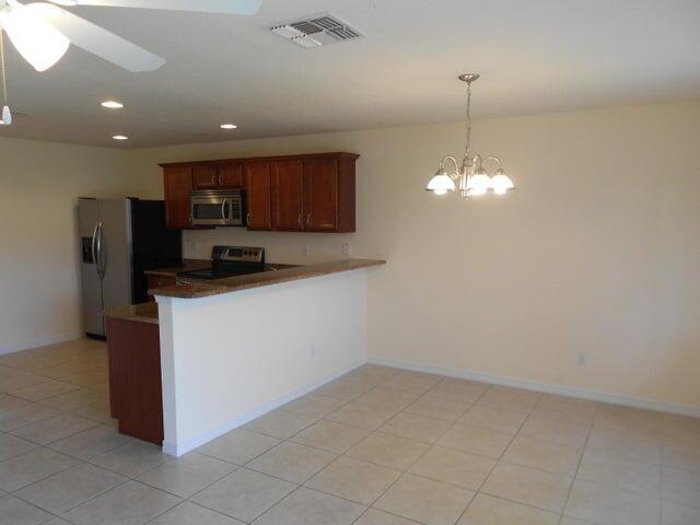2218 Rockport Road Port St. Lucie, FL 34953 - Photo 7 of 20 a view of a kitchen with a sink and dishwasher