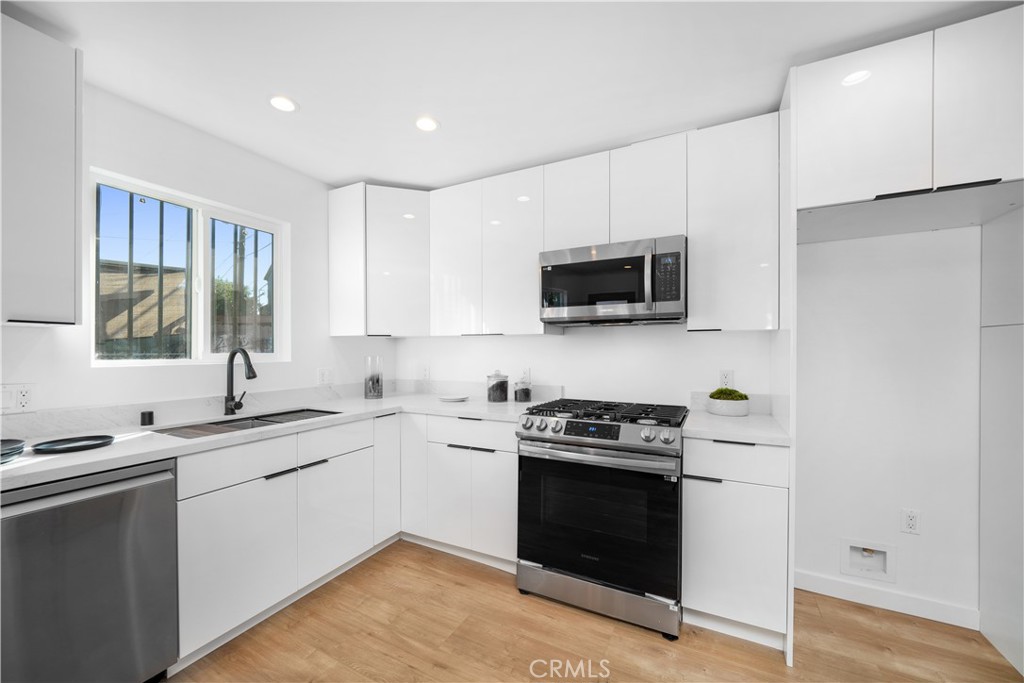 2982 Glendale Boulevard Los Angeles, CA 90039 - Photo 35 of 47 a kitchen with a sink stove and microwave