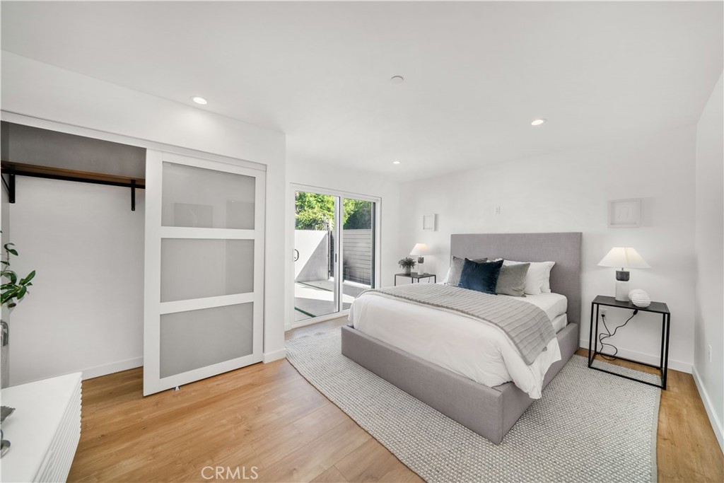 2982 Glendale Boulevard Los Angeles, CA 90039 - Photo 38 of 47 a bedroom with a large bed and a chandelier