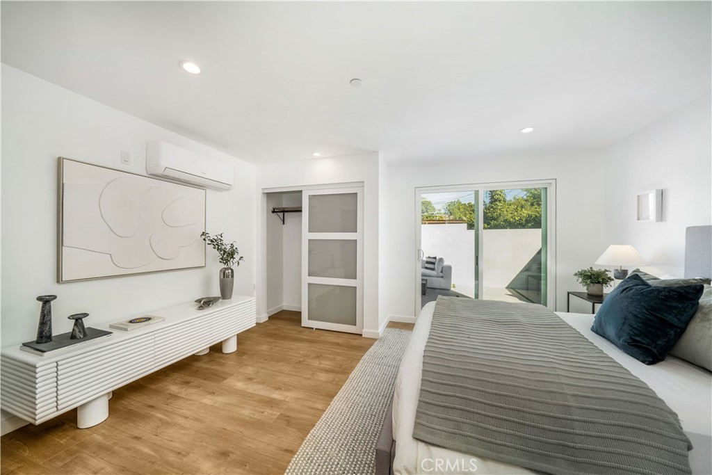 2982 Glendale Boulevard Los Angeles, CA 90039 - Photo 39 of 47 a spacious bedroom with a large bed and a window