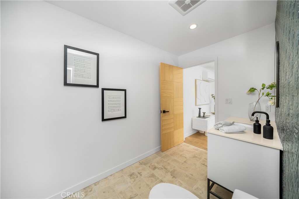 2982 Glendale Boulevard Los Angeles, CA 90039 - Photo 43 of 47 a bathroom with a sink and a mirror