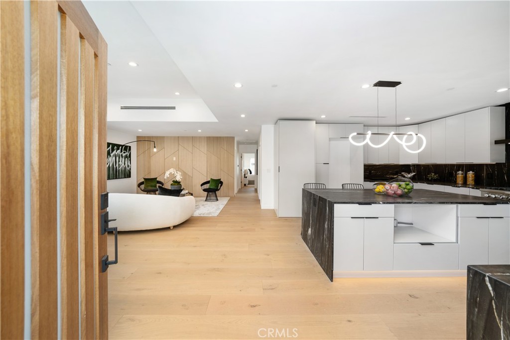 2982 Glendale Boulevard Los Angeles, CA 90039 - Photo 8 of 47 a large white kitchen with kitchen island a sink a center island and stainless steel appliances